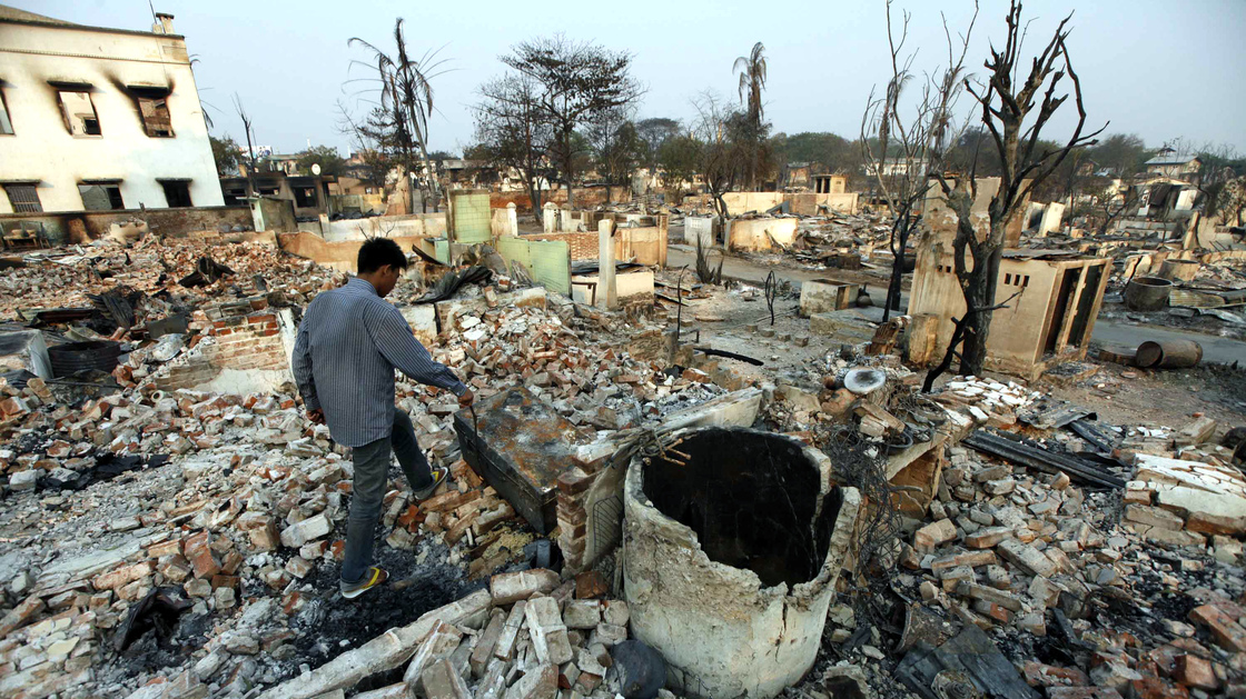 A man walks amid debris of buildings destroyed during ethnic unrest between Buddhists and Muslims in Meikhtila, about 340 miles north of Yangon, Myanmar, on Monday.