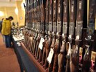 Shotguns sit on display at a gun show in Stamford, Conn. in January. Shotguns sit on display at a gun show in Stamford, Conn. in January.