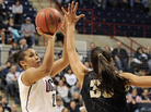 Connecticut's Kaleena Mosqueda-Lewis shoots over Vanderbilt's Elan Brown during the team's game Monday night in Storrs, Conn. Connecticut's Kaleena Mosqueda-Lewis shoots over Vanderbilt's Elan Brown during the team's game Monday night in Storrs, Conn.