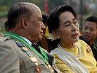 Opposition leader Aung San Suu Kyi (right) speaks with Maj. Gen. Zaw Win, deputy minister for border affairs, during a ceremony Wednesday marking Myanmar's 68th Armed Forces Day. Opposition leader Aung San Suu Kyi (right) speaks with Maj. Gen. Zaw Win, deputy minister for border affairs, during a ceremony Wednesday marking Myanmar's 68th Armed Forces Day.