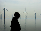 A maintenance worker looks out over an off-shore wind farm in Liverpool, England in 2008. Some people are concerned about the potential health effects of noise from wind turbines. A maintenance worker looks out over an off-shore wind farm in Liverpool, England in 2008. Some people are concerned about the potential health effects of noise from wind turbines.
