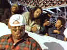 A still from the video for E-40's 1993 song "Practice Looking Hard," in which rappers like The Coup's Boots Riley (second from right) and Tupac (not pictured) also appeared.