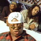 A still from the video for E-40's 1993 song "Practice Looking Hard," in which rappers like The Coup's Boots Riley (second from right) and Tupac (not pictured) also appeared. A still from the video for E-40's 1993 song "Practice Looking Hard," in which rappers like The Coup's Boots Riley (second from right) and Tupac (not pictured) also appeared.