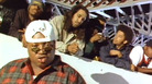 A still from the video for E-40's 1993 song "Practice Looking Hard," in which rappers like The Coup's Boots Riley (second from right) and Tupac (not pictured) also appeared. A still from the video for E-40's 1993 song "Practice Looking Hard," in which rappers like The Coup's Boots Riley (second from right) and Tupac (not pictured) also appeared.
