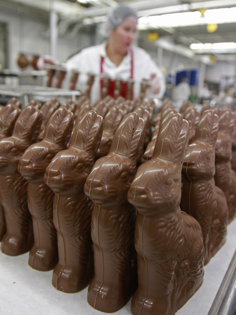 While many people enjoy sweet treats  like these chocolate bunnies  the price of a key ingredient has some people bitter. A government subsidy program is criticized for keeping sugar prices too high. But as prices fall, the government may buy sugar to help processors.