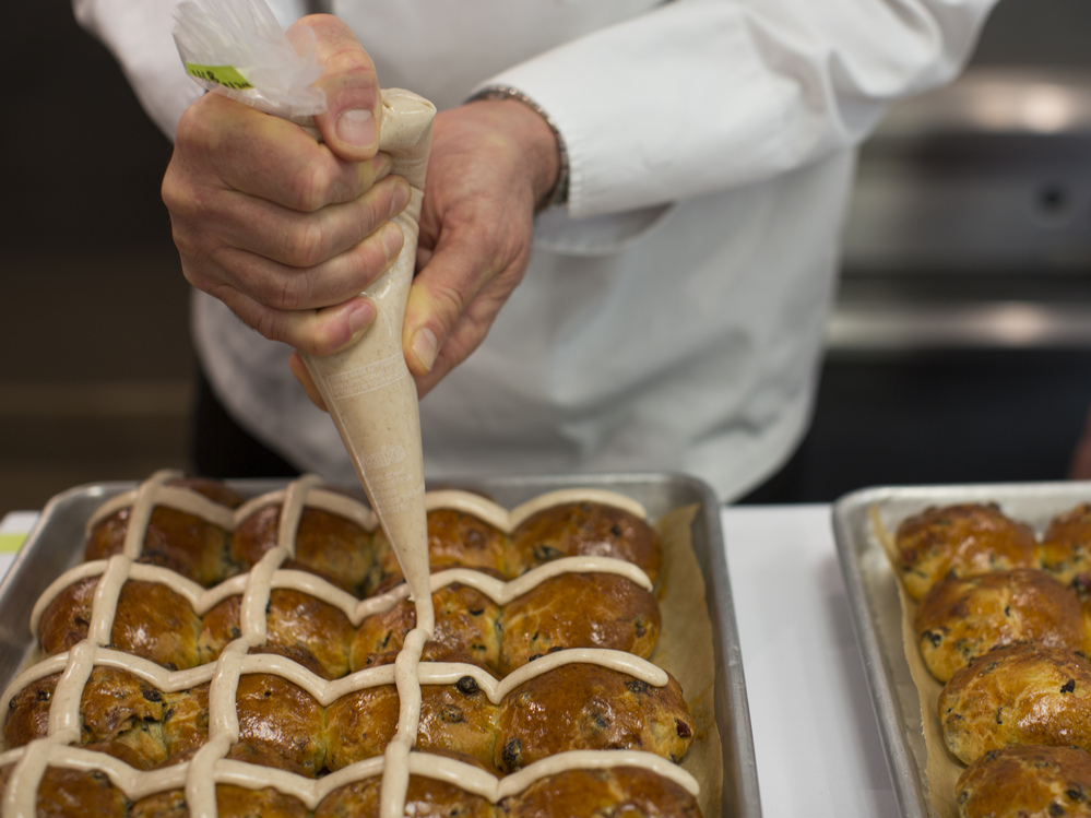 Chef Thomas Keller demonstrates how to apply homemade icing to his hot cross buns.