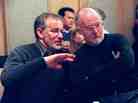 Steven Spielberg and John Williams confer during a break in rehearsal at Symphony Hall on Feb. 21, 1998 in Boston. Tom Hanks stands in back.