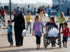 Syrian refugees are pictured at Kilis refugee camp in Gaziantep, Turkey, on Nov. 1. An estimated 150,000 Syrians are reported to be living in the Turkish border town. Syrian refugees are pictured at Kilis refugee camp in Gaziantep, Turkey, on Nov. 1. An estimated 150,000 Syrians are reported to be living in the Turkish border town.