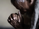 A worshipper prays during Good Friday Mass in Islamabad, Pakistan. A worshipper prays during Good Friday Mass in Islamabad, Pakistan.