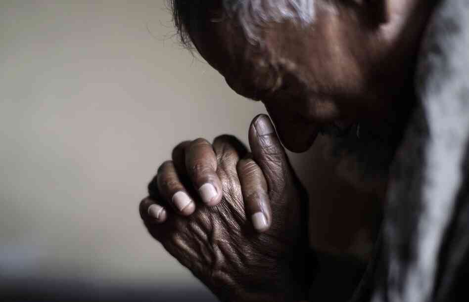 A worshipper prays during Good Friday Mass in Islamabad, Pakistan. A worshipper prays during Good Friday Mass in Islamabad, Pakistan.