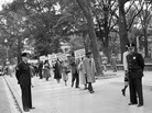 Officers stand by in 1955 as religious leaders from Chicago demonstrate outside the White House in Washington over the murder of 14-year-old Emmett Till. Officers stand by in 1955 as religious leaders from Chicago demonstrate outside the White House in Washington over the murder of 14-year-old Emmett Till.