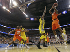 Syracuse forward C.J. Fair (No. 5) shoots over Marquette forward Jamil Wilson (No. 0) during the second half of the East Regional final in the NCAA men's college basketball tournament on Saturday. Syracuse forward C.J. Fair (No. 5) shoots over Marquette forward Jamil Wilson (No. 0) during the second half of the East Regional final in the NCAA men's college basketball tournament on Saturday.
