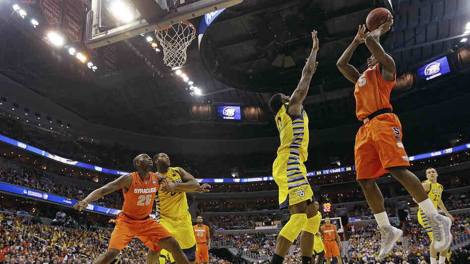 Syracuse forward C.J. Fair (No. 5) shoots over Marquette forward Jamil Wilson (No. 0) during the second half of the East Regional final in the NCAA men's college basketball tournament on Saturday. Syracuse forward C.J. Fair (No. 5) shoots over Marquette forward Jamil Wilson (No. 0) during the second half of the East Regional final in the NCAA men's college basketball tournament on Saturday.