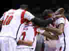 The Louisville Cardinals huddle up on the court after teammate Kevin Ware injured his leg in the first half against the Duke Blue Devils on Sunday. The Louisville Cardinals huddle up on the court after teammate Kevin Ware injured his leg in the first half against the Duke Blue Devils on Sunday.