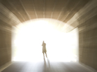 Image of a human figure before a bright light Image of a human figure before a bright light