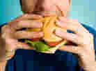 Man eats a hamburger