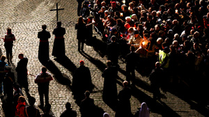 Parishioners partake in the Way Of The Cross procession at the Colosseum on Good Friday in Rome. A group of women Catholics recently made a pilgrimage to Rome to request that women once again be allowed to hold leadership positions in the church.