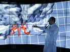 Andreas Linninger, University of Illinois, Chicago, professor of bioengineering, chemical engineering and computer science (left), adjusts his 3-D glasses Jan. 24 as brain surgeon Ali Alaraj talks about viewing the brain inside CAVE2, a system of 72 stereoscopic liquid crystal display panels that encircles the viewer and creates a 3-D environment. Andreas Linninger, University of Illinois, Chicago, professor of bioengineering, chemical engineering and computer science (left), adjusts his 3-D glasses Jan. 24 as brain surgeon Ali Alaraj talks about viewing the brain inside CAVE2, a system of 72 stereoscopic liquid crystal display panels that encircles the viewer and creates a 3-D environment.