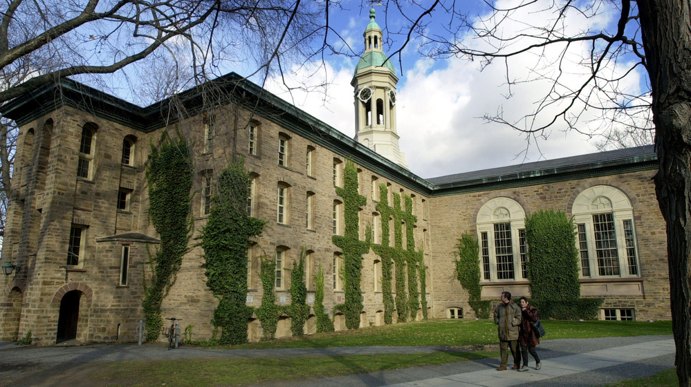 A couple walks past Nassau Hall on the Princeton Unversity campus in Princeton, N.J. A letter to the editor in The Daily Princetonian urging female students to find a husband before they graduate has drawn criticism.