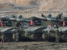 South Korean marines work on their K-55 self-propelled howitzers during an exercise against possible attacks by North Korea near the border village of Panmunjom in Paju, South Korea, Wednesday. South Korean marines work on their K-55 self-propelled howitzers during an exercise against possible attacks by North Korea near the border village of Panmunjom in Paju, South Korea, Wednesday.