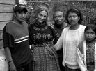 Donna De Cesare (second from left) and the family of Carlos Perez, who took the photograph. De Cesare met Perez when he was 18 years old and was involved with gangs, and they became close friends. He became her photo assistant, slowly eased out of gang life and is now a working artist. Donna De Cesare (second from left) and the family of Carlos Perez, who took the photograph. De Cesare met Perez when he was 18 years old and was involved with gangs, and they became close friends. He became her photo assistant, slowly eased out of gang life and is now a working artist.