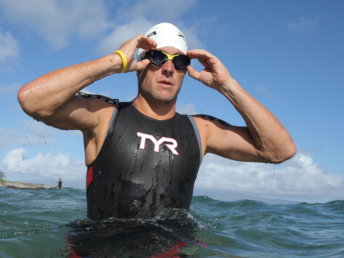 Lance Armstrong warms up for the swimming leg of the 2011 Xterra World Championship triathlon in Kapalua, Hawaii (before he was banned from most competitions). This weekend, he'll swim in a Texas meet for masters swimmers.