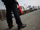 On Thursday, a South Korean security guard kept watch as South Korean trucks waited to enter the Kaesong industrial complex in North Korea. For the second day, the North blocked the trucks and workers from the South from entering its territory. On Thursday, a South Korean security guard kept watch as South Korean trucks waited to enter the Kaesong industrial complex in North Korea. For the second day, the North blocked the trucks and workers from the South from entering its territory.