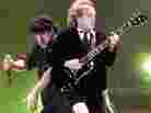 Brian Johnson (L) and Angus Young of AC/DC in 2000. Johnson's first album with the group, 1980's Back In Black, is one of the best-selling albums of all time, despite never reaching No. 1 on the Billboard album chart.