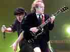 Brian Johnson (L) and Angus Young of AC/DC in 2000. Johnson's first album with the group, 1980's Back In Black, is one of the best-selling albums of all time, despite never reaching No. 1 on the Billboard album chart.