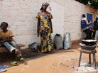 Kadidja Mamath sells hot porridge made of rice, sugar and milk on the roadside in the capital city, Bangui. The 19-year-old says the people of CAR have suffered enough and are ready for the coups to stop. Kadidja Mamath sells hot porridge made of rice, sugar and milk on the roadside in the capital city, Bangui. The 19-year-old says the people of CAR have suffered enough and are ready for the coups to stop.
