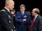 Lt. Gen. Richard Harding, Air Force judge advocate general, center, speaks with Army Lt. Gen. Dana Chipman, left, and Robert Taylor, acting general counsel of the Defense Department, prior to testifying before the Senate subcommittee on sexual assault on March 13. Lt. Gen. Richard Harding, Air Force judge advocate general, center, speaks with Army Lt. Gen. Dana Chipman, left, and Robert Taylor, acting general counsel of the Defense Department, prior to testifying before the Senate subcommittee on sexual assault on March 13.