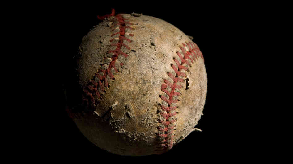 Closeup of an old, worn baseball Closeup of an old, worn baseball