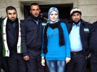 Razan Shalab Al-Sham, in bright blue, works for the Syrian Emergency Task Force. She helped provide uniforms for the new civil police force of Khirbet al-Joz in northern Syria. Razan Shalab Al-Sham, in bright blue, works for the Syrian Emergency Task Force. She helped provide uniforms for the new civil police force of Khirbet al-Joz in northern Syria.