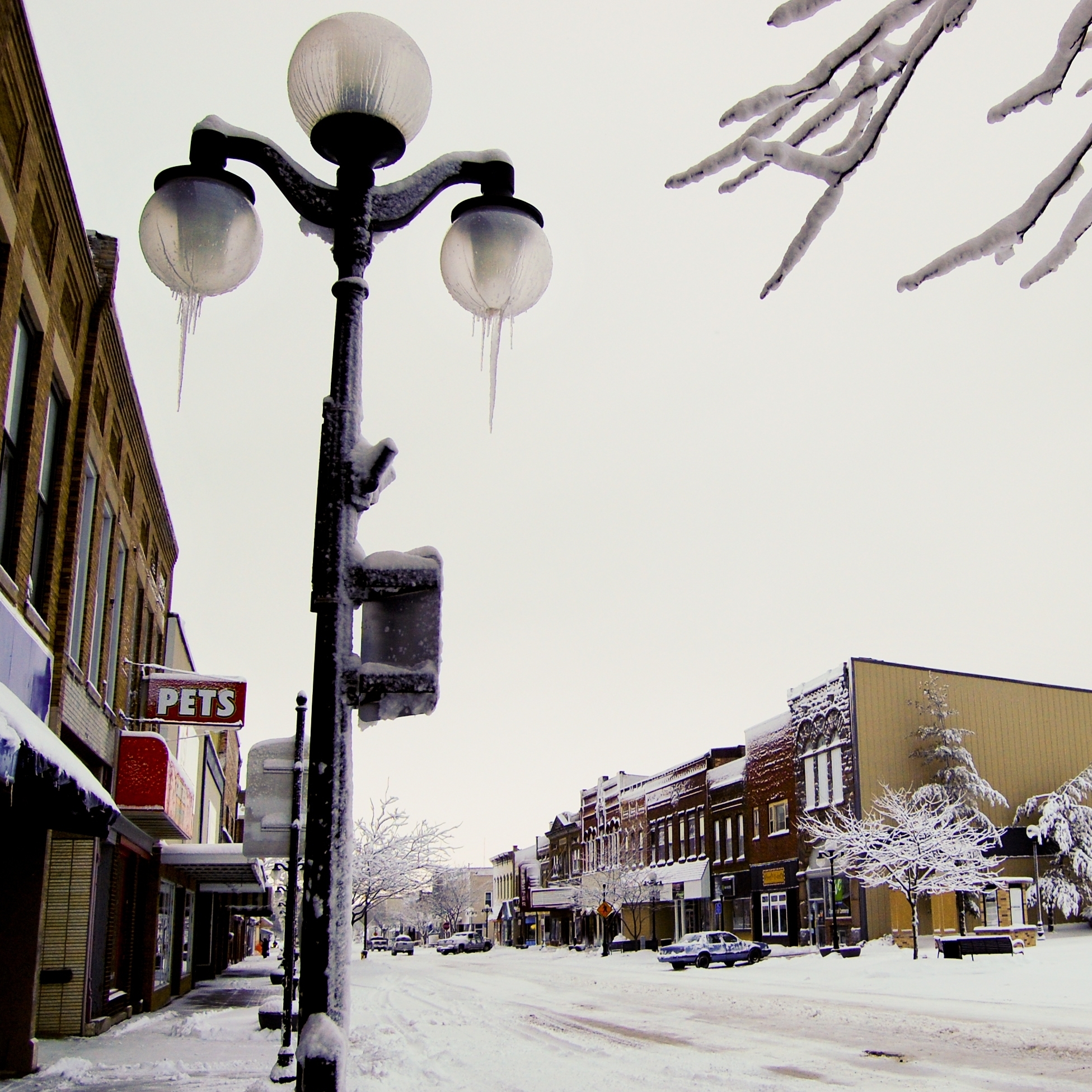 Main Street in Webster City, Iowa, has so far survived the 2011 closure of an Electrolux factory. But retraining funds and unemployment are running out for former workers, leaving businesses worried that a serious downturn is ahead.
