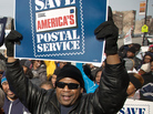 A Chicago postal worker protests in support of Saturday mail delivery in February. A Chicago postal worker protests in support of Saturday mail delivery in February.