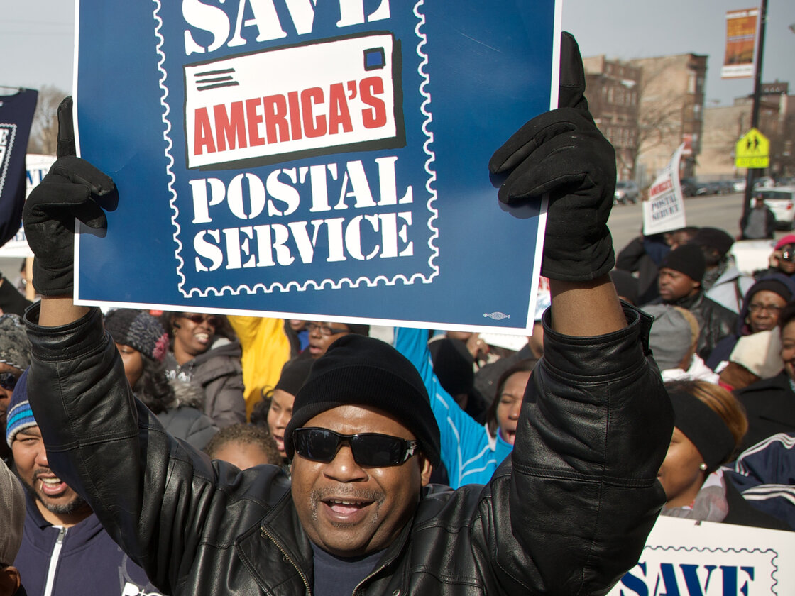 A Chicago postal worker protests in support of Saturday mail delivery in February. A Chicago postal worker protests in support of Saturday mail delivery in February.