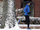 A Denver man runs in the snow near Washington Park after a winter storm moved through town in late January.