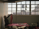 A worker with The Empowerment Plan creates a coat that will later be donated to a homeless person. The organization works inside Ponyride, a 30,000-square-foot warehouse near downtown Detroit. The warehouse hosts other local businesses, too. A worker with The Empowerment Plan creates a coat that will later be donated to a homeless person. The organization works inside Ponyride, a 30,000-square-foot warehouse near downtown Detroit. The warehouse hosts other local businesses, too.