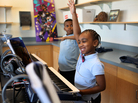 Jionni Anderson is a third grader at Savoy Elementary School. Anderson raises her hand to answer a question in Mr. Scott's keyboard class. Jionni Anderson is a third grader at Savoy Elementary School. Anderson raises her hand to answer a question in Mr. Scott's keyboard class.