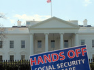 A sign outside the White House on Tuesday protests part of President Obama's proposed federal budget. A sign outside the White House on Tuesday protests part of President Obama's proposed federal budget.