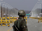 A South Korean soldier stands at a military checkpoint connecting South and North Korea at the Unification Bridge last week in Paju, South Korea. A South Korean soldier stands at a military checkpoint connecting South and North Korea at the Unification Bridge last week in Paju, South Korea.