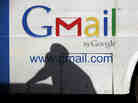 A man's shadow reflects on a bus with an ad for Gmail in Lagos, Nigeria. Google has introduced Inactive Account Manager to help plan for digital life after death.