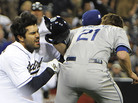 Ouch! Carlos Quentin (left) of the San Diego Padres charged the mound Thursday after Los Angeles Dodgers pitcher Zack Greinke (right) hit him with a pitch. In the brawl, Greinke broke his left collarbone. Ouch! Carlos Quentin (left) of the San Diego Padres charged the mound Thursday after Los Angeles Dodgers pitcher Zack Greinke (right) hit him with a pitch. In the brawl, Greinke broke his left collarbone.