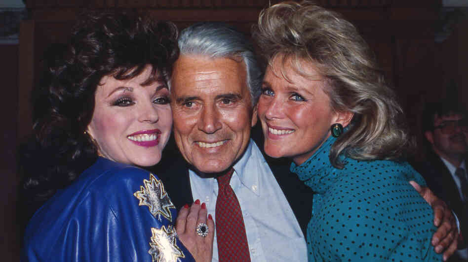 Joan Collins, John Forsythe and Linda Evans at a party celebrating the production of 150 episodes of Dynasty in 1986. Joan Collins, John Forsythe and Linda Evans at a party celebrating the production of 150 episodes of Dynasty in 1986.