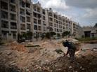A Syrian rebel patrols the area in the Sheikh Maqsud district of the northern city of Aleppo, on Thursday. A Syrian rebel patrols the area in the Sheikh Maqsud district of the northern city of Aleppo, on Thursday.
