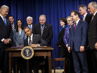 Vice President Biden and members of Congress watch as President Obama signs the STOCK Act on April 4, 2012. A year later, Congress moved to undo large portions of the law without fanfare. Vice President Biden and members of Congress watch as President Obama signs the STOCK Act on April 4, 2012. A year later, Congress moved to undo large portions of the law without fanfare.
