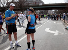 A runner uses his cellphone after two bombs exploded at the Boston Marathon on Monday. A runner uses his cellphone after two bombs exploded at the Boston Marathon on Monday.
