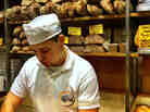 A young baker at the Roscioli bakery in Rome prepares bread.