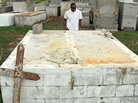 Lionel Alverez stands at a family tomb in Plaquemines Parish, La. Hurricane Isaac's storm surge split the double-decker tomb in half, leaving his aunt's and sister's caskets on the bottom but washing away his mother's, which was on top. Lionel Alverez stands at a family tomb in Plaquemines Parish, La. Hurricane Isaac's storm surge split the double-decker tomb in half, leaving his aunt's and sister's caskets on the bottom but washing away his mother's, which was on top.