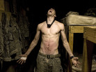 Spc. Tad Donoho screams with pain in 2008 after being administered a "pink belly" for his birthday in Korengal Valley, Kunar province, Afghanistan. Each member of the platoon strikes his stomach until it begins to bruise, hence the name pink belly. From the book Infidel. Spc. Tad Donoho screams with pain in 2008 after being administered a "pink belly" for his birthday in Korengal Valley, Kunar province, Afghanistan. Each member of the platoon strikes his stomach until it begins to bruise, hence the name pink belly. From the book Infidel.